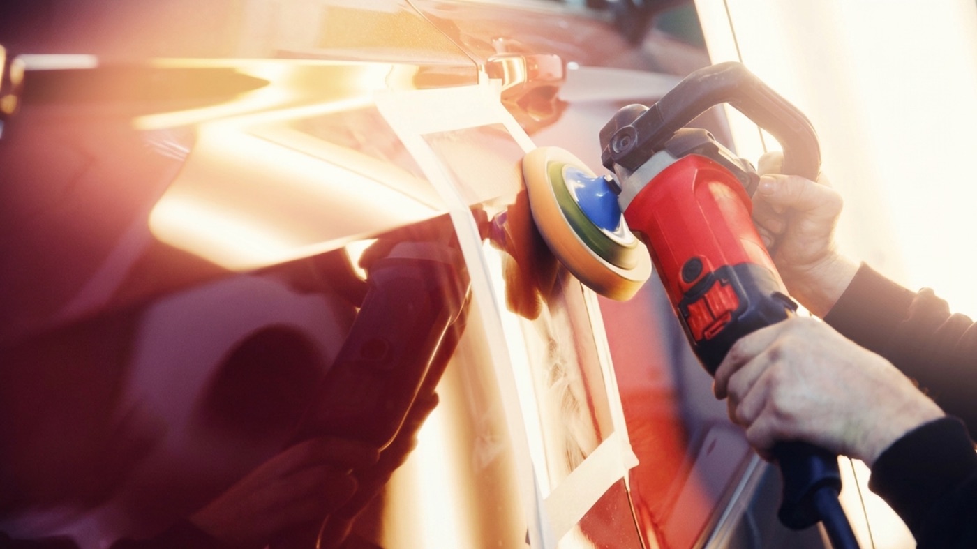 Machine paint correction — a dual-action polisher cutting back a car panel to a deep shine at AutoDrive Salisbury Plain