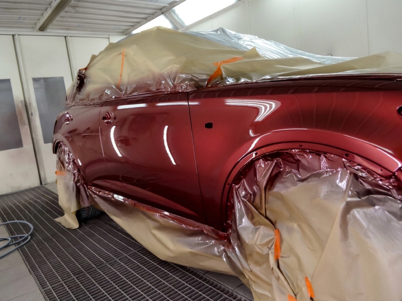 A car freshly resprayed to a deep, flawless factory finish in the AutoDrive spray booth